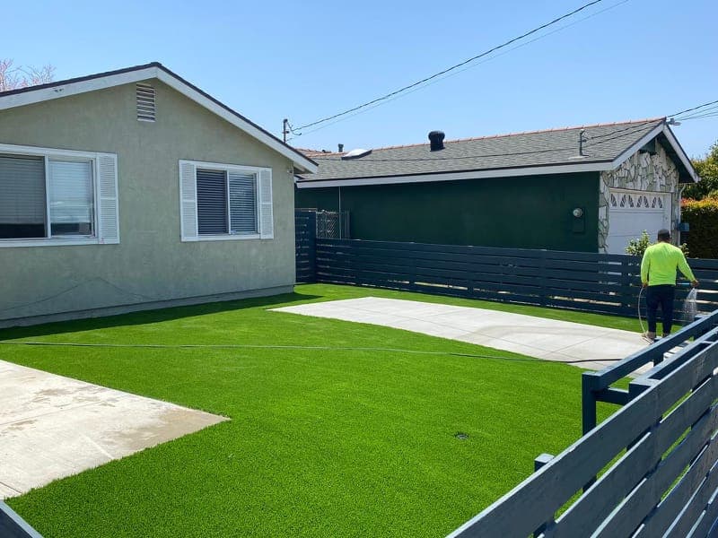 Newly installed artificial turf lawn with clean edging and modern layout
