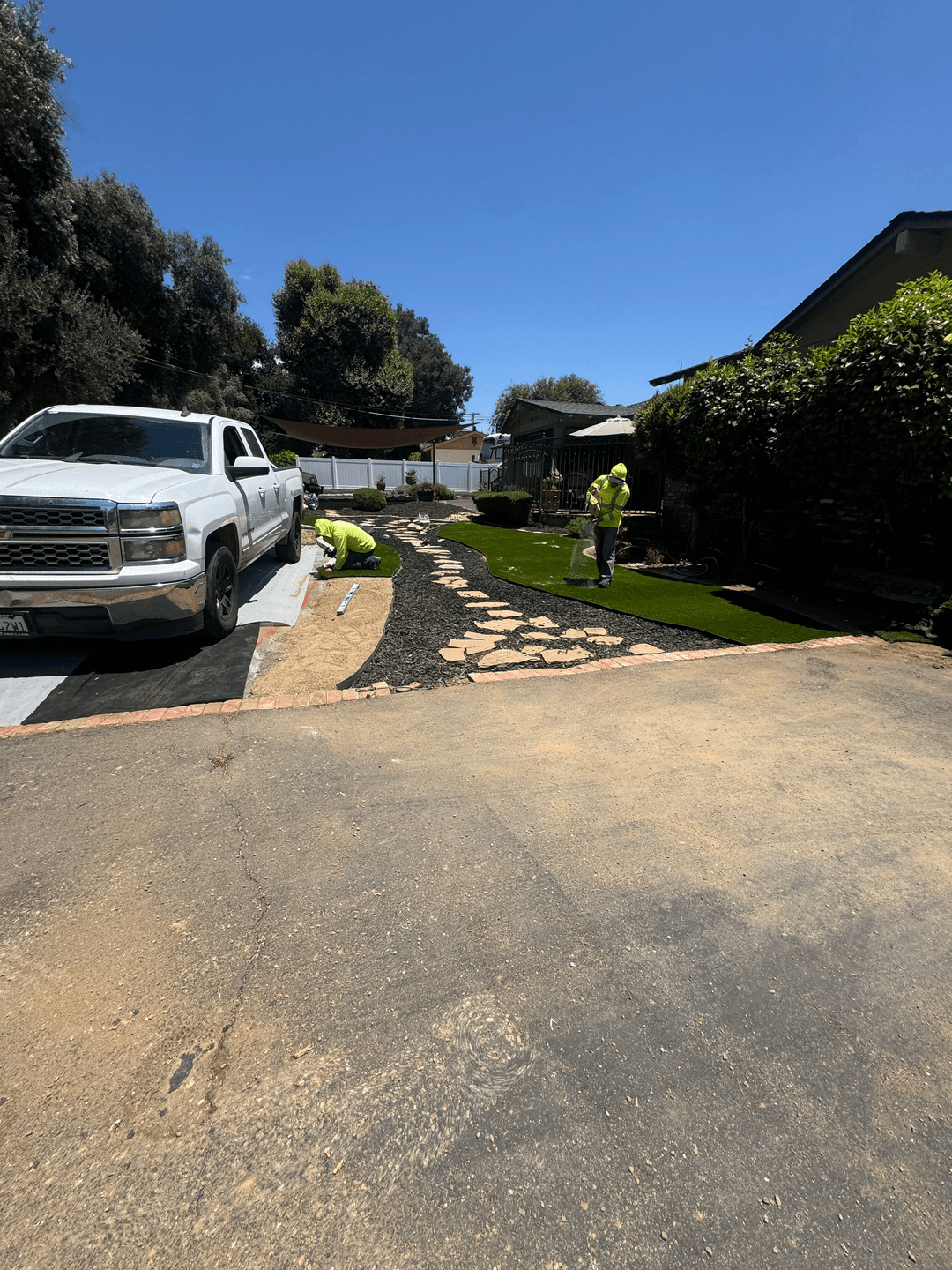 Driveway cleanup and yard preparation before full exterior renovation