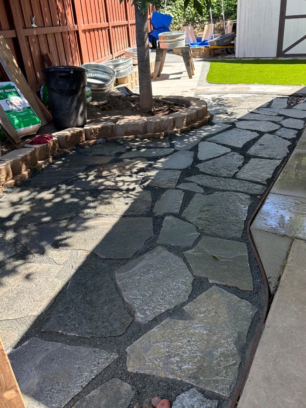 Freshly installed stone walkway with clean edging and durable outdoor hardscape surface in San Diego